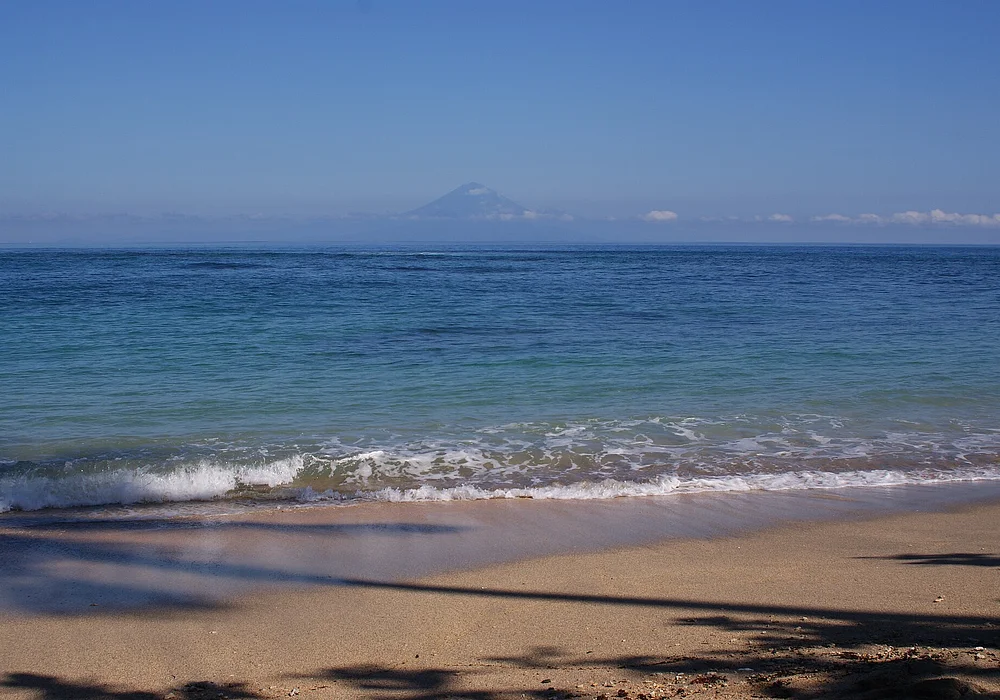 Senggigi Beach, view of Lombok Strait and Mount Agung in the distance