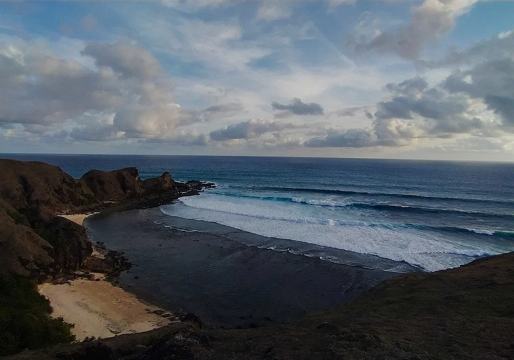 A beach below the Merese Hill in Lombok at sunset