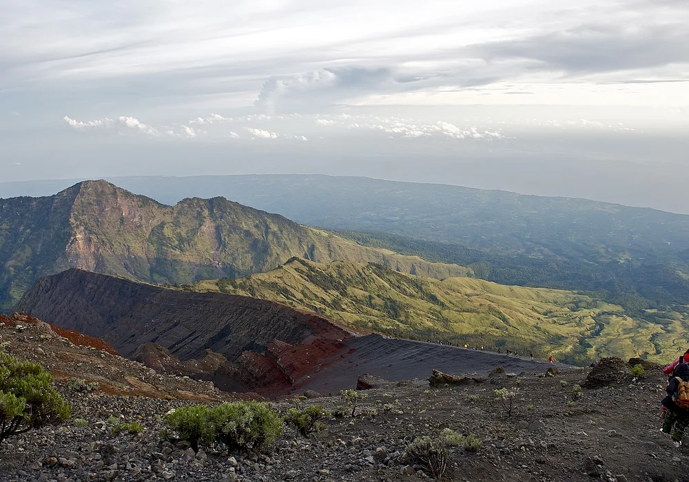 Descent from the 2,726 m high Rinjani summit at the indonesian island Lombok at the middle of the Rinjani National Park. With a incredible view down to the Indian Ocean.